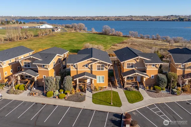 an aerial view of a house with a ocean view
