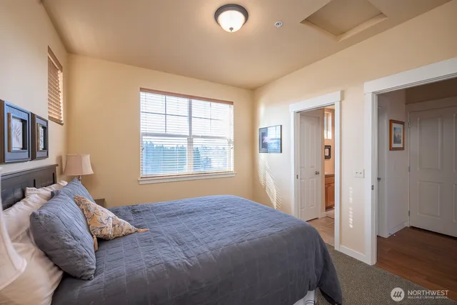 a bedroom with bed and a window