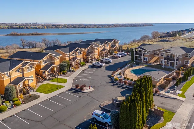 an aerial view of a house with outdoor seating