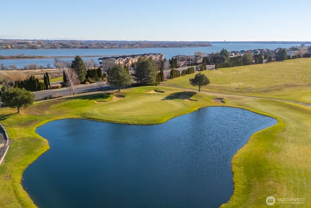 a view of a swimming pool with an ocean view