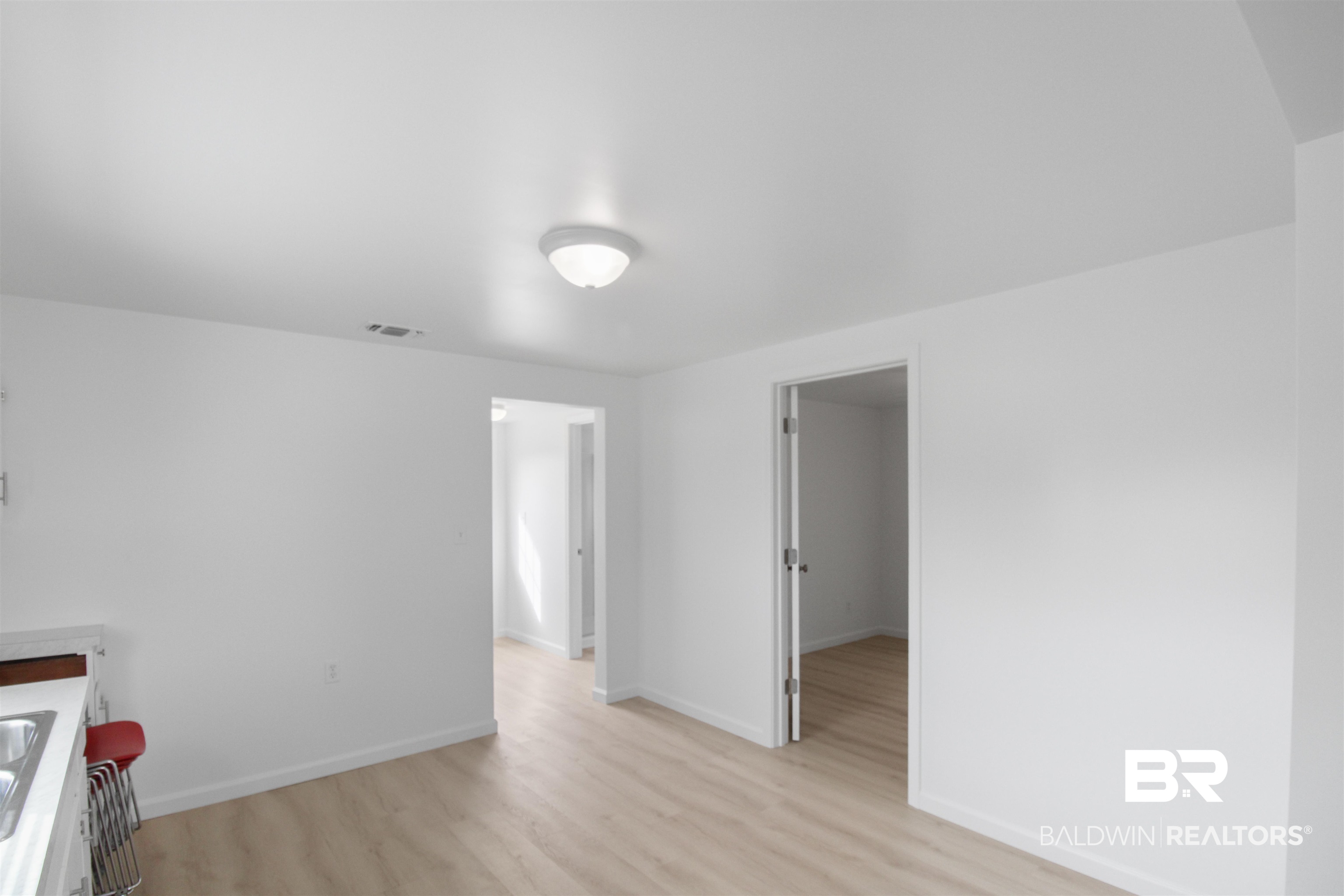 17622 Brewer Road Foley, AL 36535 - Photo 15 of 26 Unfurnished room with baseboards and light wood-style floors