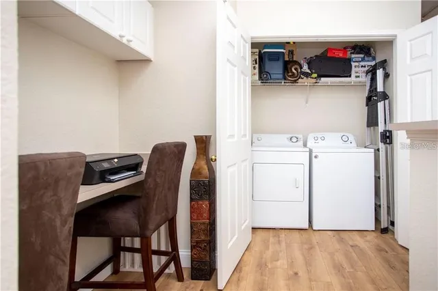 a utility room with dryer and washer