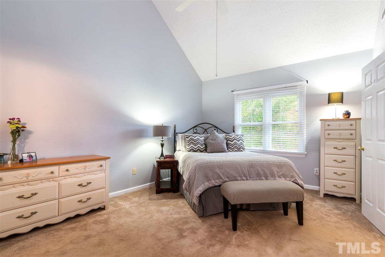 2016 Stonepond Lane Raleigh, NC 27603 - Photo 13 of 23 Vaulted ceilings add to the charm of this large master bedroom.