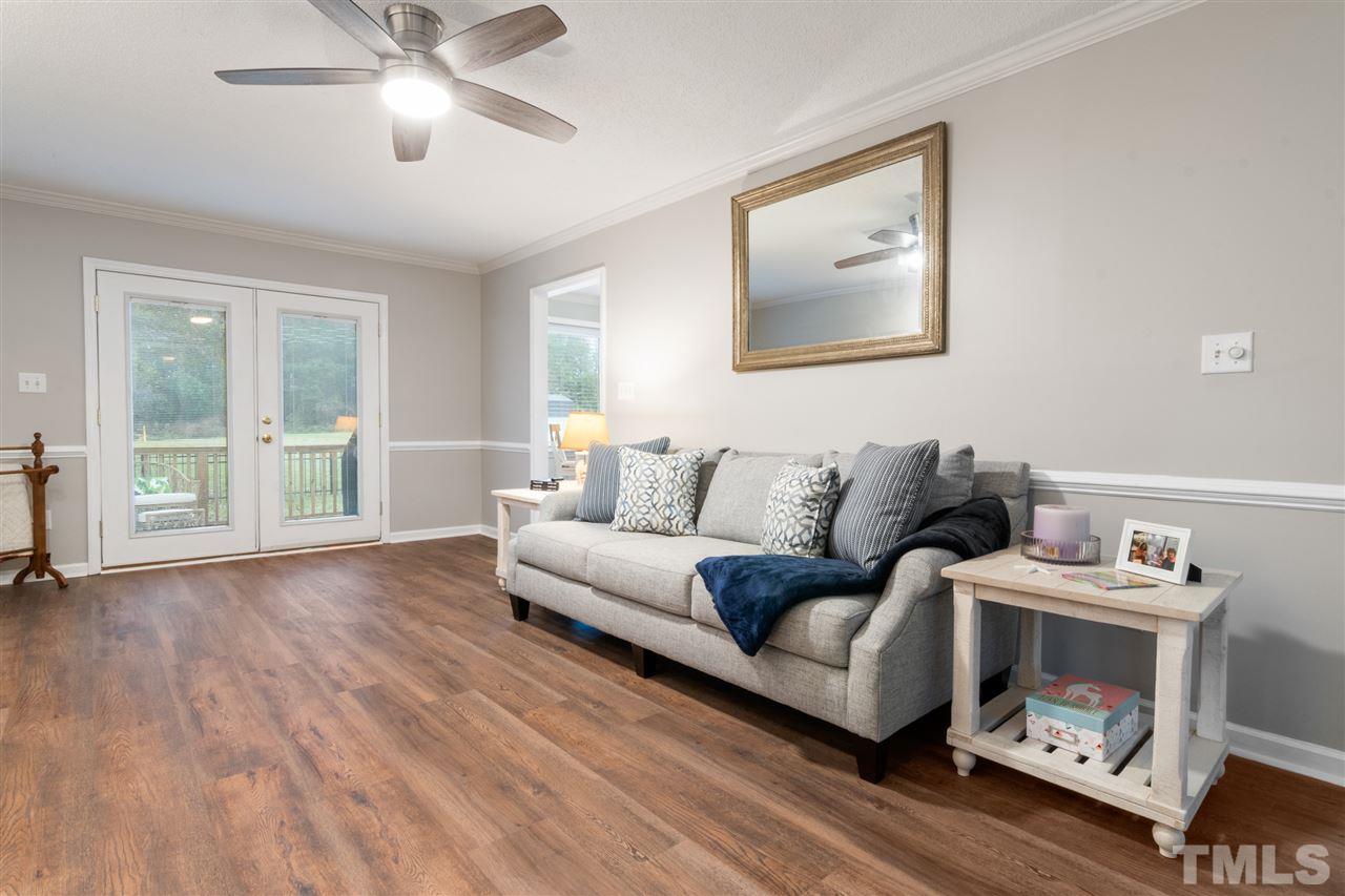 2016 Stonepond Lane Raleigh, NC 27603 - Photo 6 of 23 The family room boasts operable double doors overlooking the deck and view of the huge backyard.