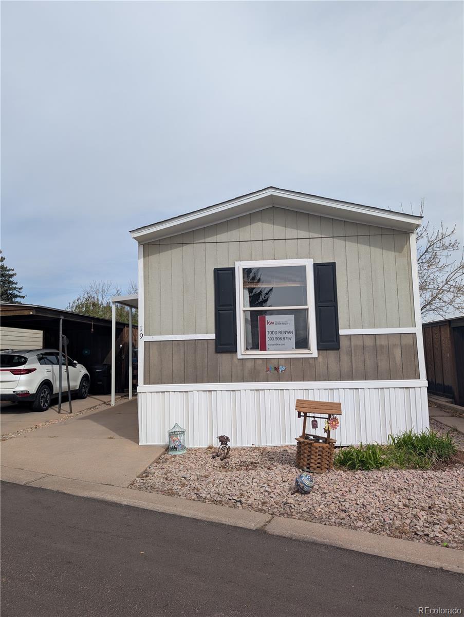 19 Danny Street Castle Rock, CO 80109 - Photo 1 of 33 a front view of a house with a yard and garage