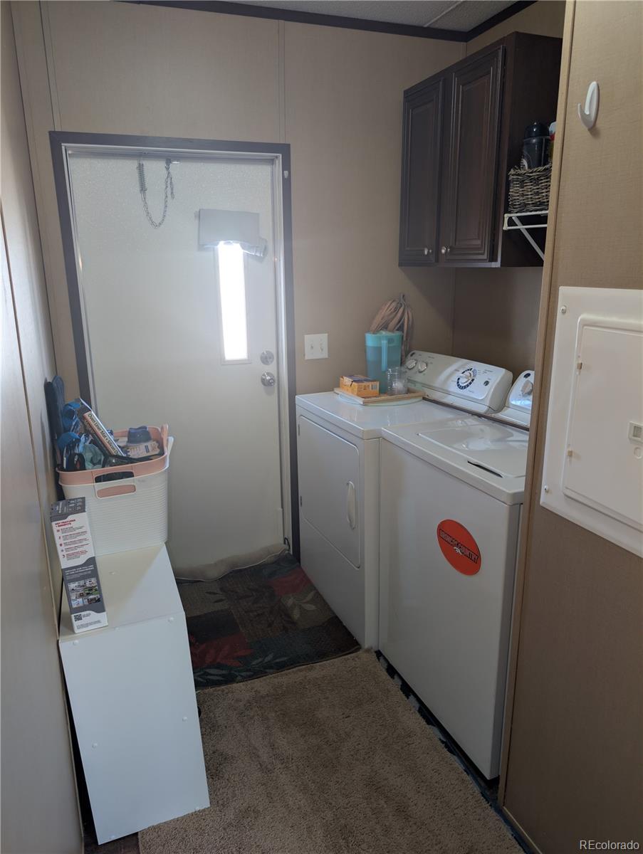 19 Danny Street Castle Rock, CO 80109 - Photo 13 of 33 a utility room with dryer and washer