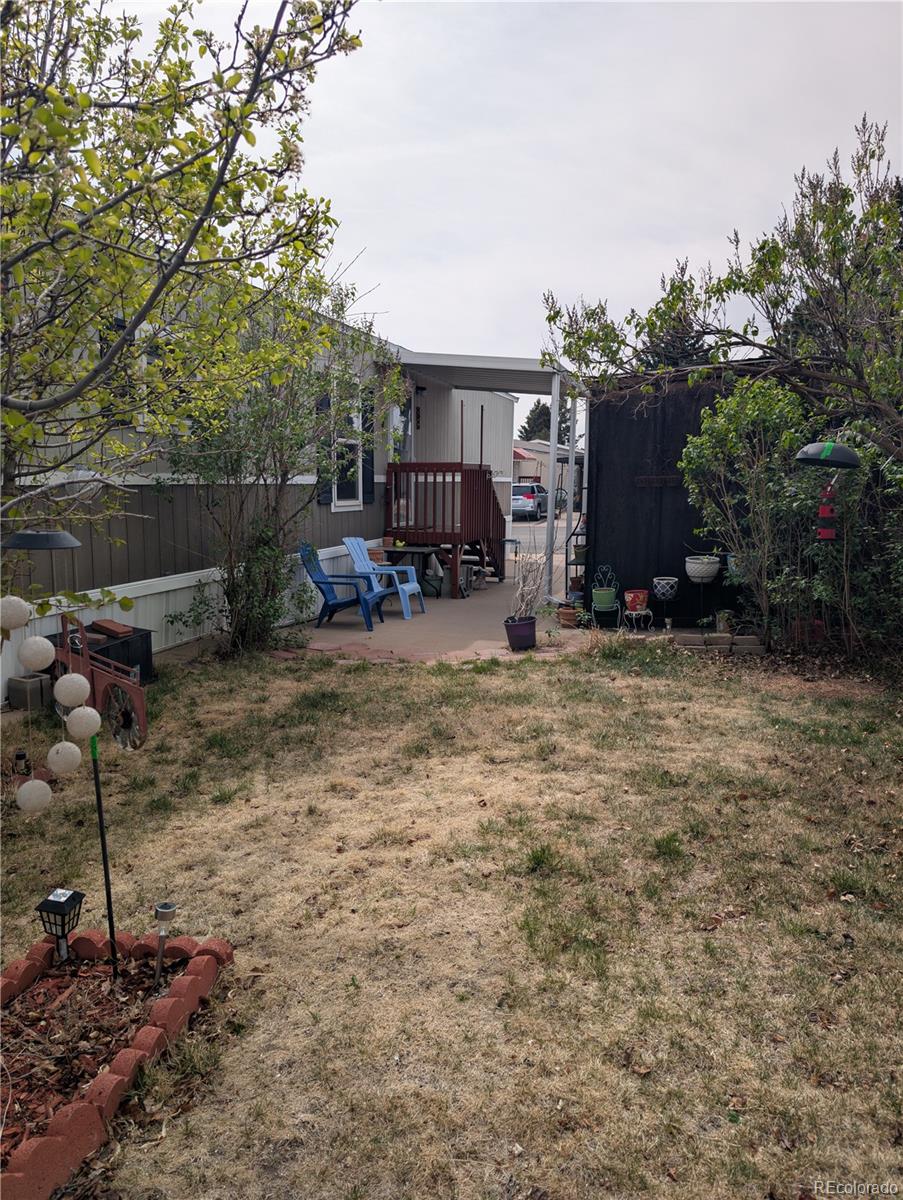 19 Danny Street Castle Rock, CO 80109 - Photo 28 of 33 a view of a backyard with sitting area and furniture