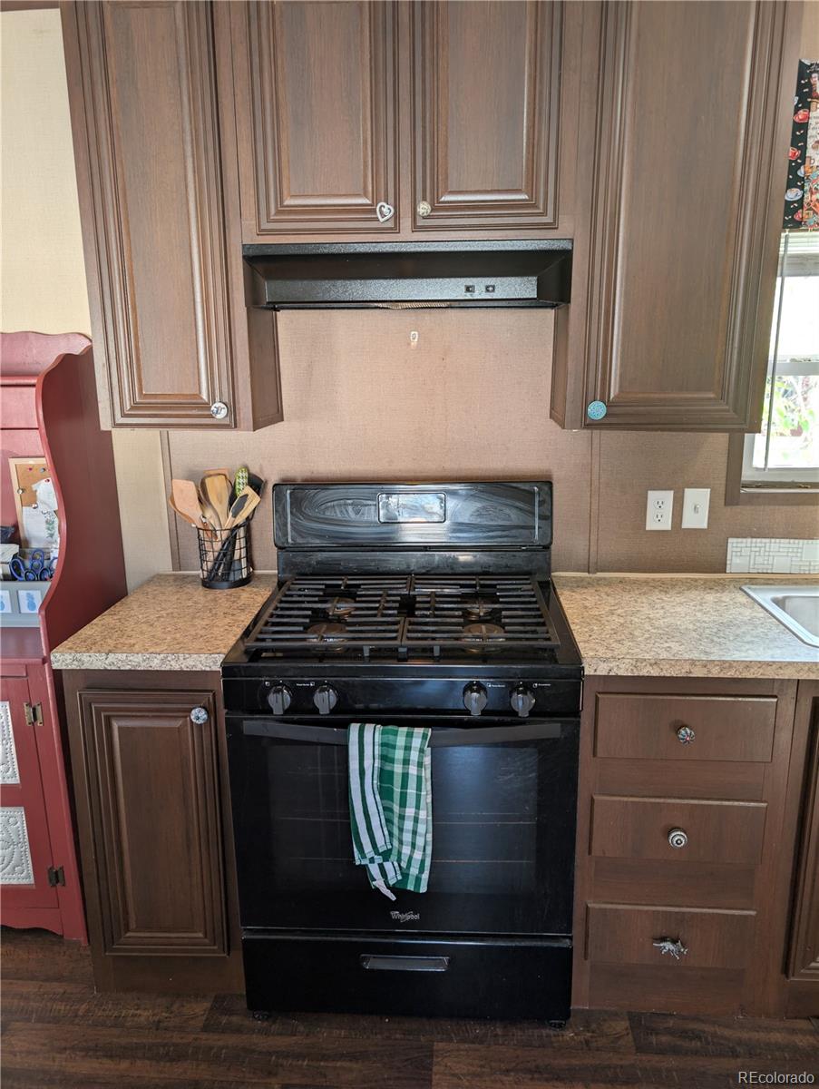19 Danny Street Castle Rock, CO 80109 - Photo 10 of 33 a stove top oven sitting inside of a kitchen