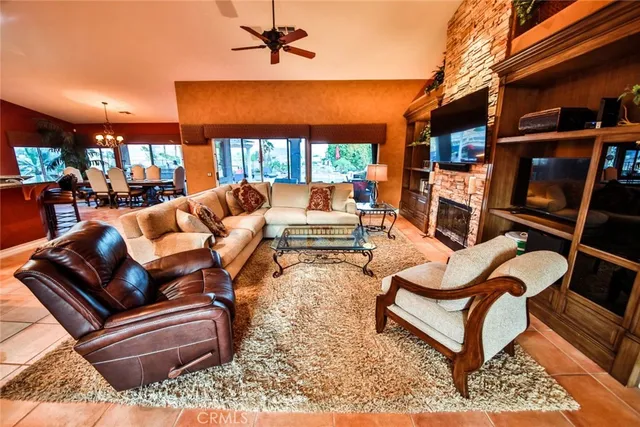 a outdoor living space with patio furniture and a fireplace