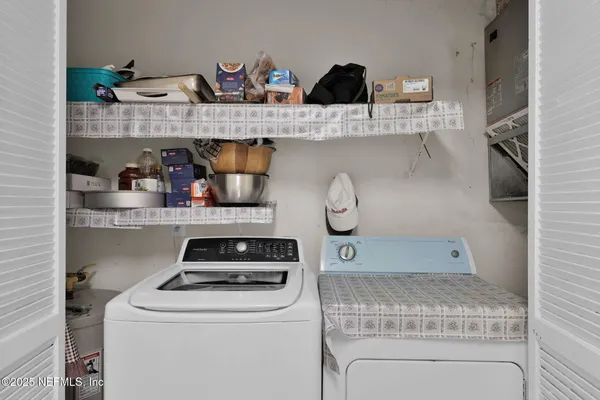 a kitchen with a stove and cabinets