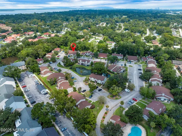 an aerial view of residential houses with outdoor space
