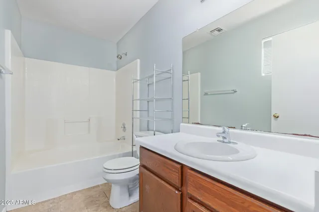 a bathroom with a sink toilet a shower and a mirror