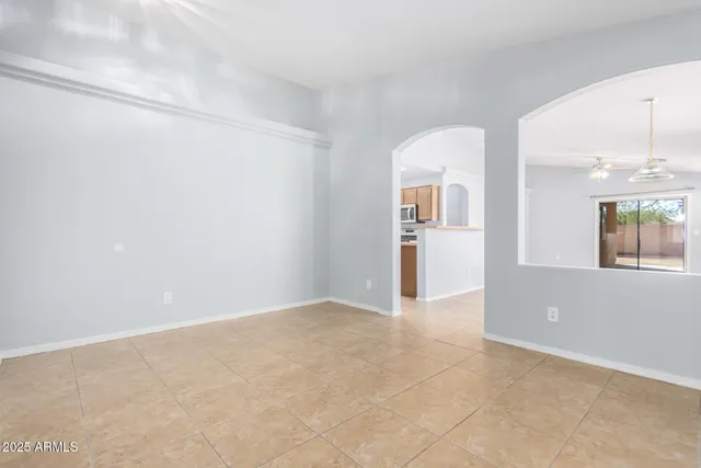 an empty room with windows and entrance