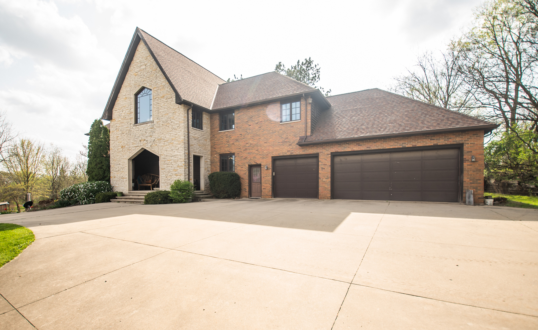 1131 4th Avenue Dixon, IL 61021 - Photo 16 of 82 a front view of a house with a yard and garage