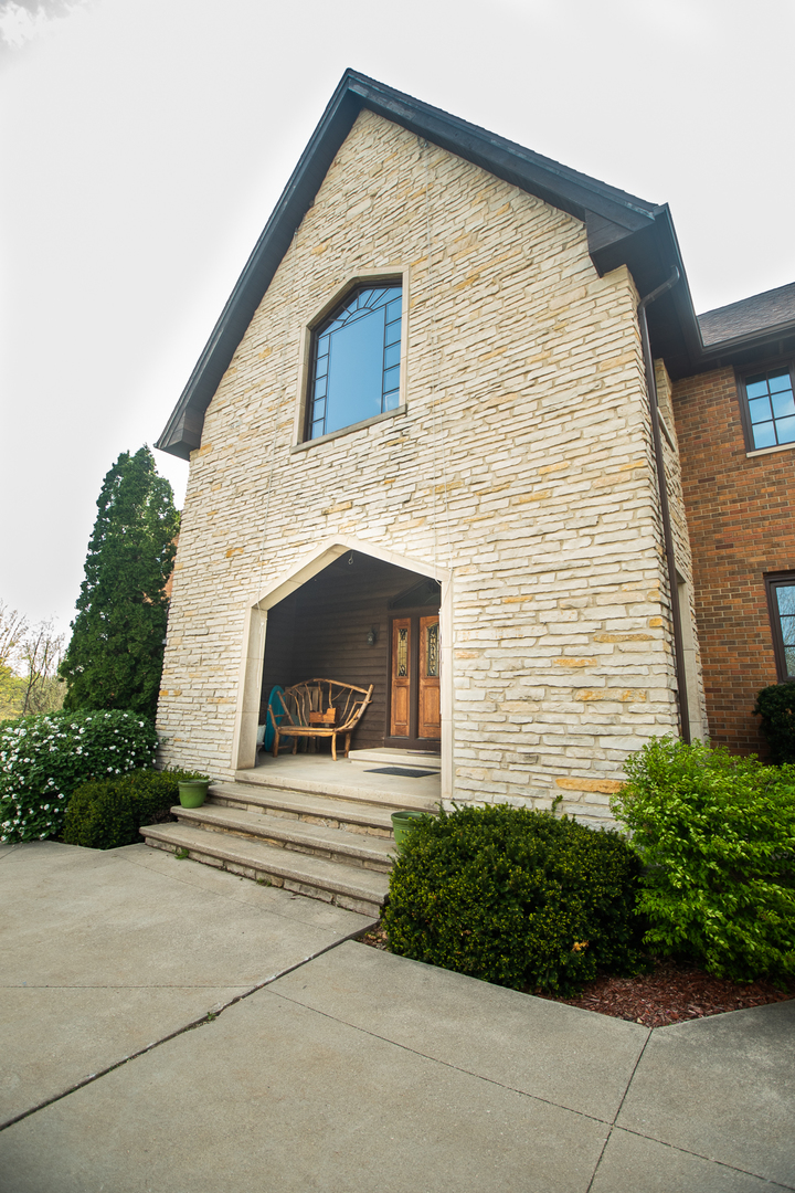 1131 4th Avenue Dixon, IL 61021 - Photo 17 of 82 a front view of a house with garden