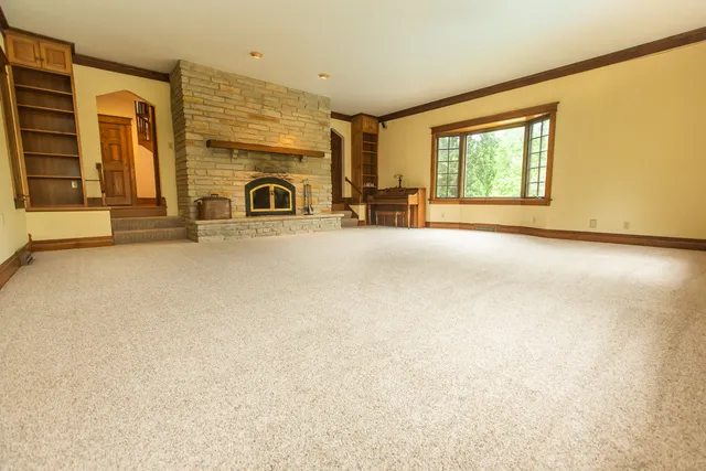 a view of a room with wooden floor and bedroom