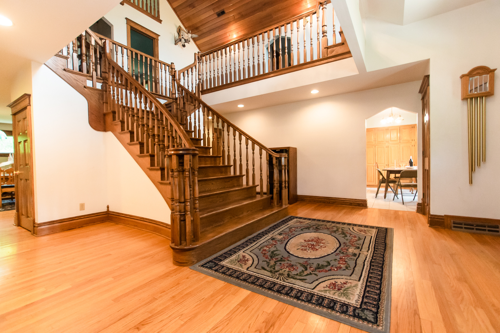 1131 4th Avenue Dixon, IL 61021 - Photo 22 of 82 a view of a hallway with wooden floor and a kitchen