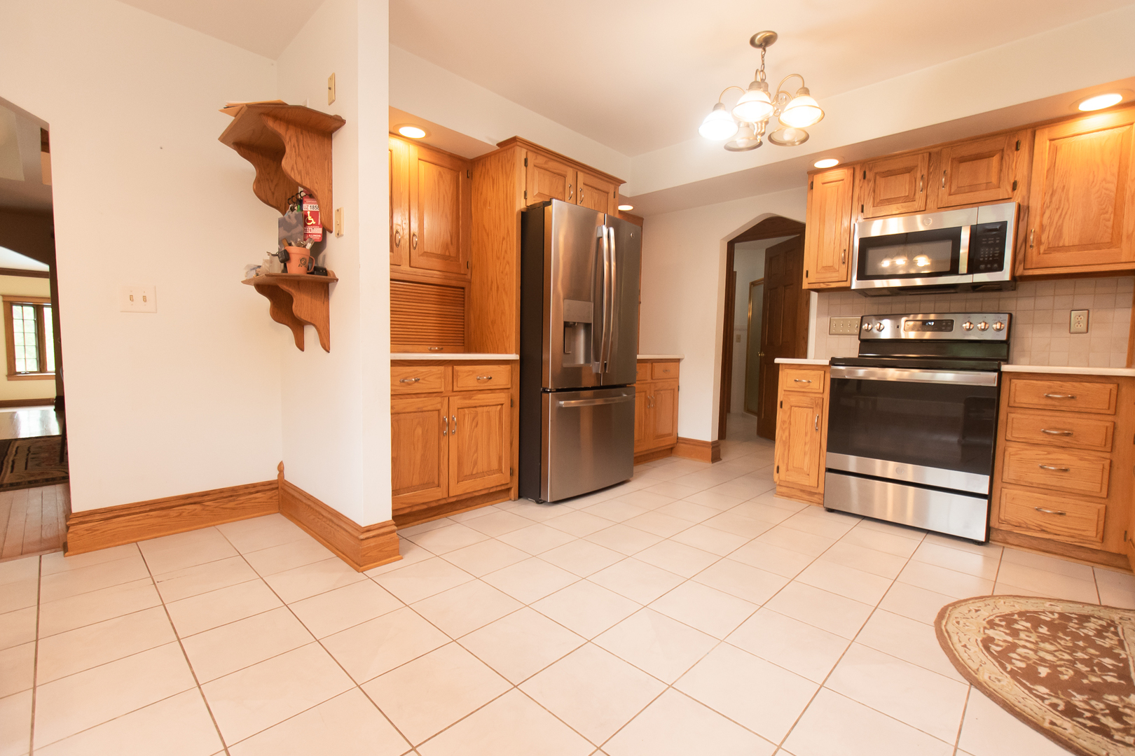 1131 4th Avenue Dixon, IL 61021 - Photo 27 of 82 a kitchen with stainless steel appliances granite countertop a refrigerator and a stove top oven