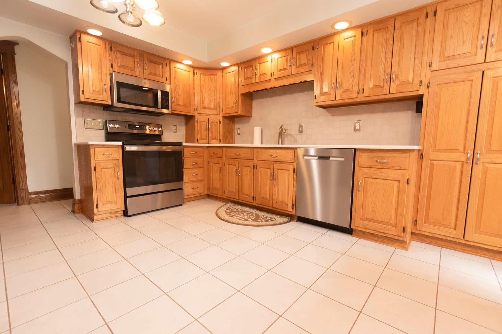 1131 4th Avenue Dixon, IL 61021 - Photo 28 of 82 a kitchen with stainless steel appliances a refrigerator sink and cabinets