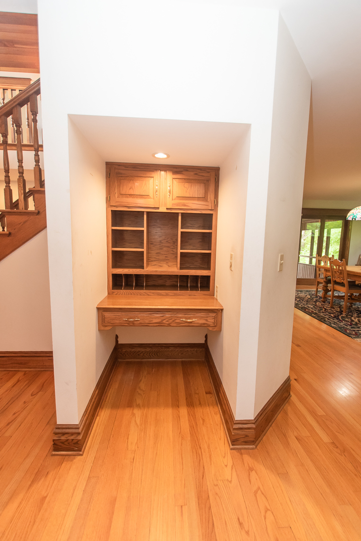 1131 4th Avenue Dixon, IL 61021 - Photo 29 of 82 a view of a room with wooden floor and bedroom