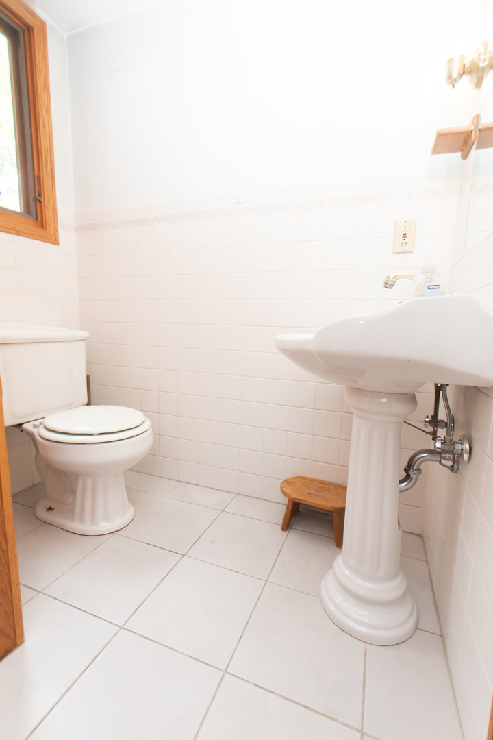 1131 4th Avenue Dixon, IL 61021 - Photo 32 of 82 a bathroom with a sink and a toilet