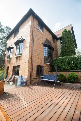 a view of a field with large trees