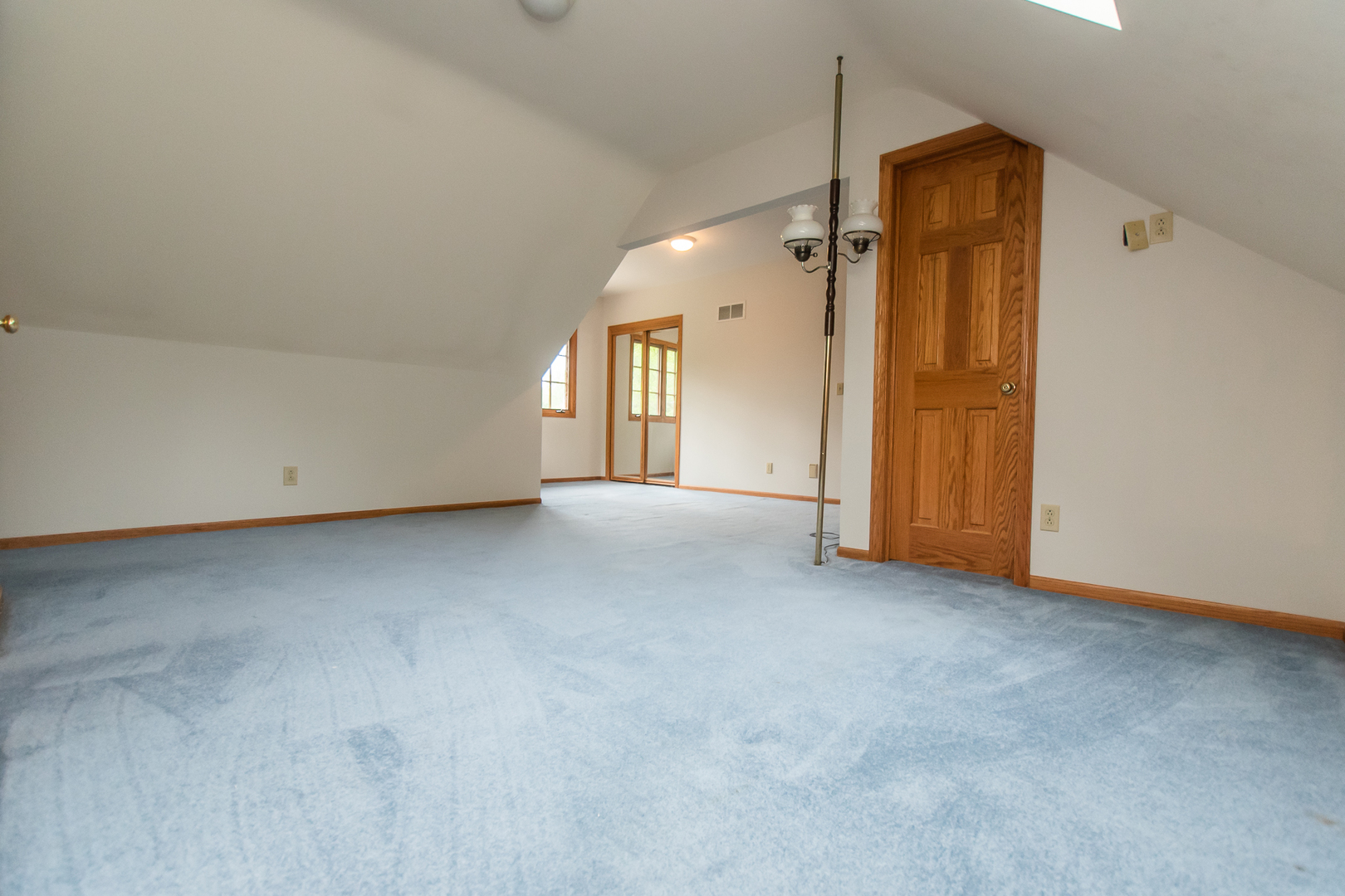 1131 4th Avenue Dixon, IL 61021 - Photo 48 of 82 an empty room with closet and a chandelier fan