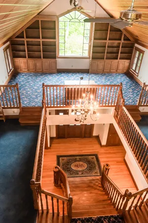 an aerial view of a house with a swimming pool yard and outdoor seating