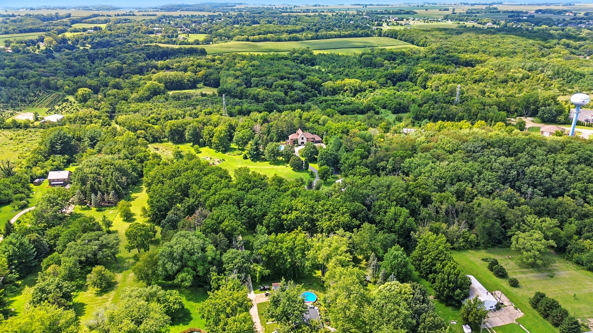 1131 4th Avenue Dixon, IL 61021 - Photo 74 of 82 a view of a lush green forest with trees and houses