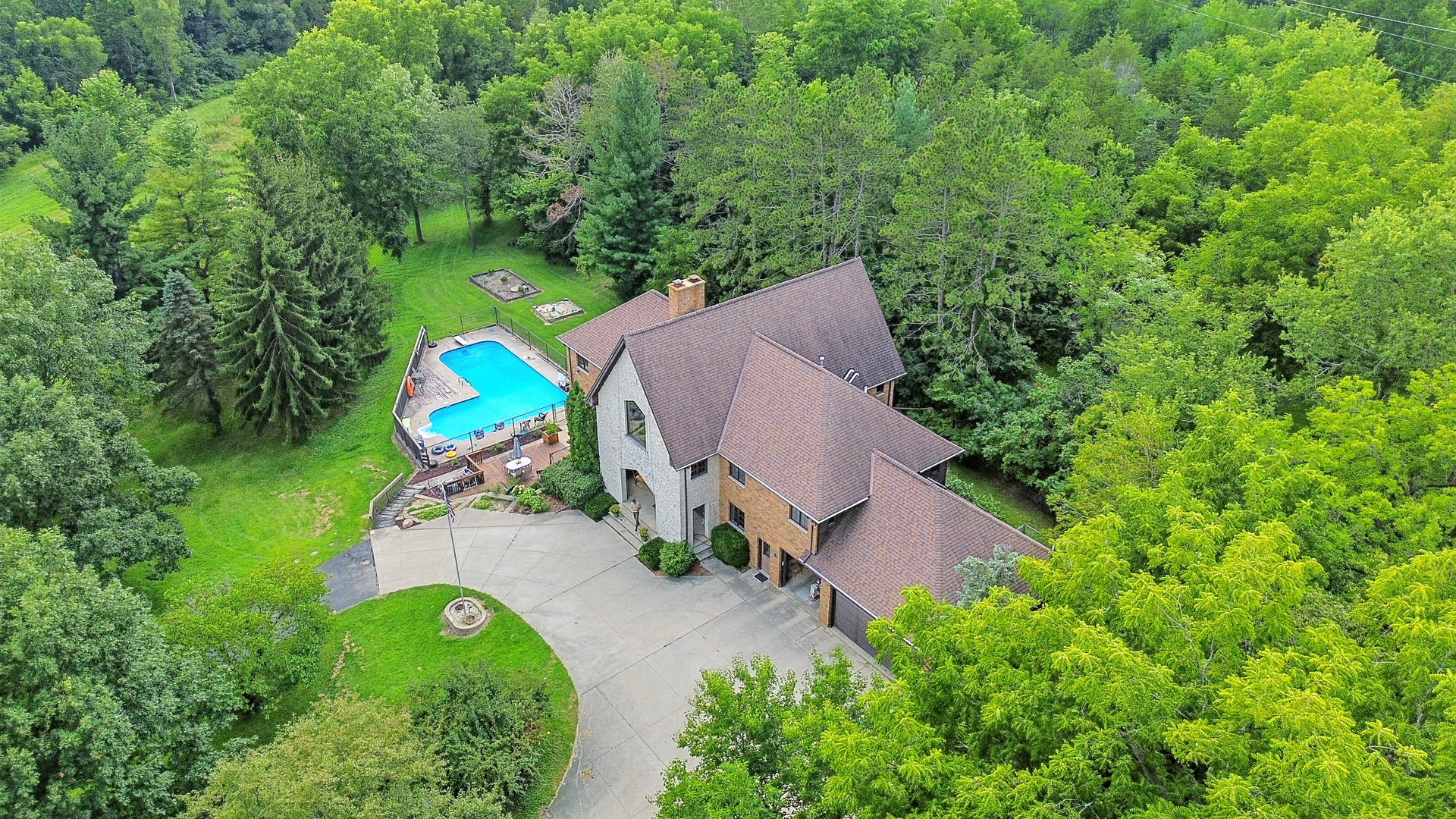 1131 4th Avenue Dixon, IL 61021 - Photo 77 of 82 an aerial view of a house with a swimming pool yard and outdoor seating