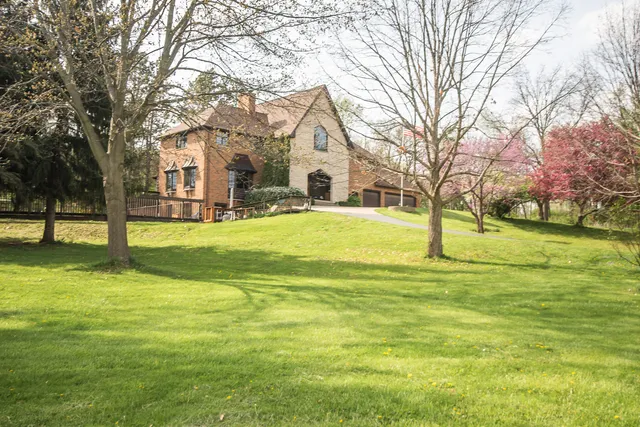 a view of a wooden deck with a yard