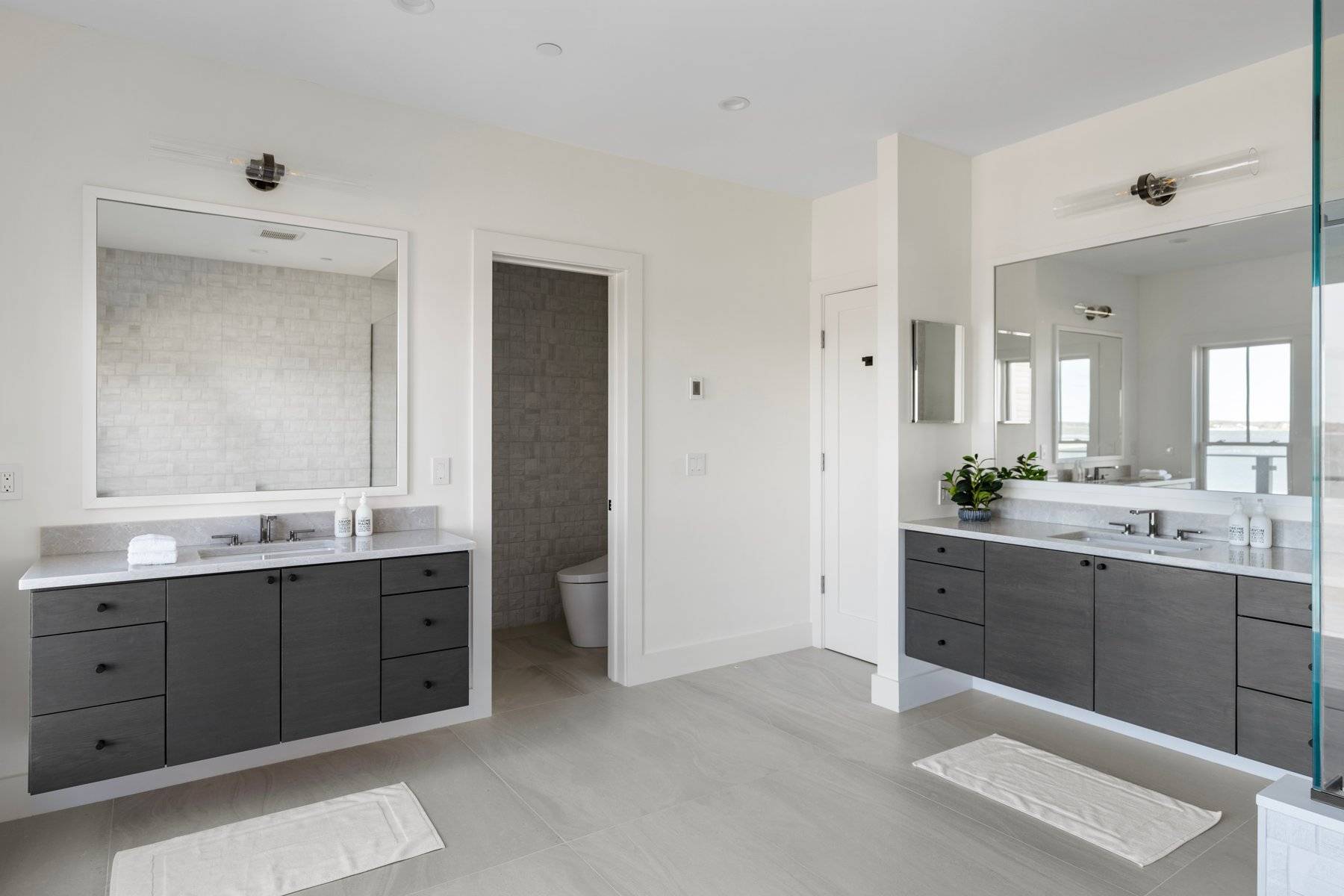 686 Dune Road Westhampton Beach, NY 11978 - Photo 28 of 37 a spacious bathroom with a double vanity sink mirror and double