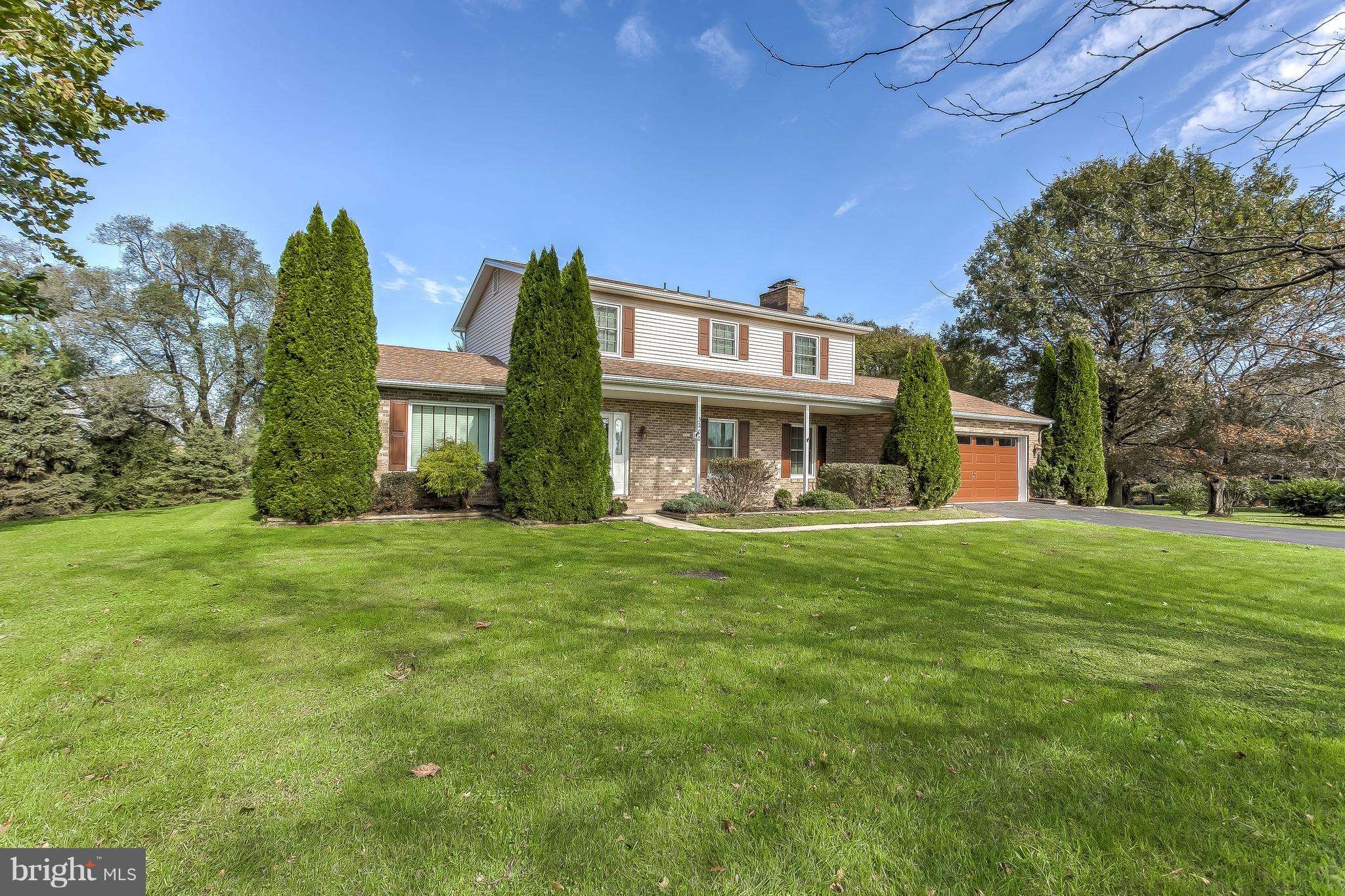 3200 Troyer Road White Hall, MD 21161 - Photo 2 of 36 a front view of a house with a yard