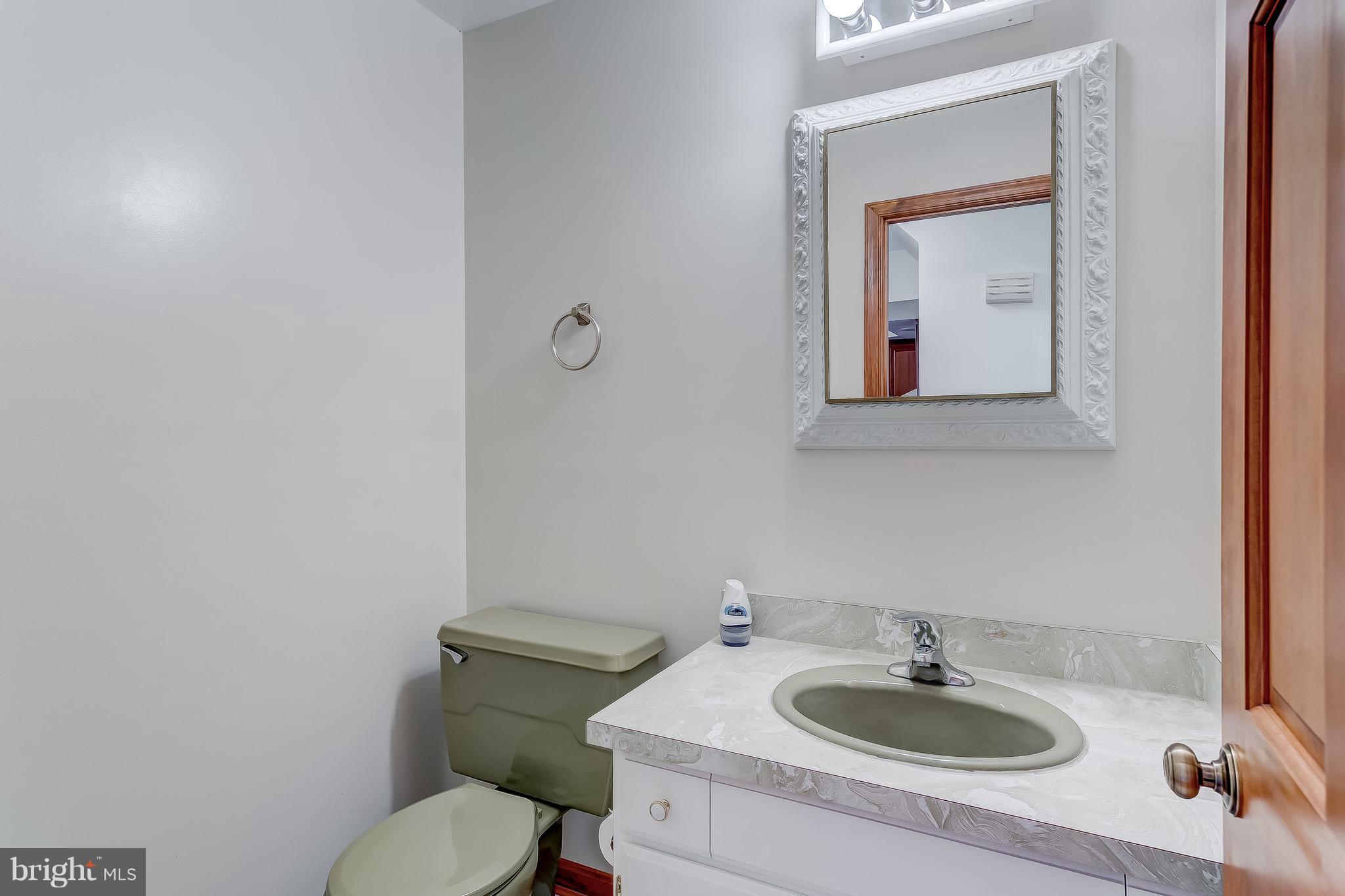 3200 Troyer Road White Hall, MD 21161 - Photo 15 of 36 a bathroom with a toilet sink and mirror