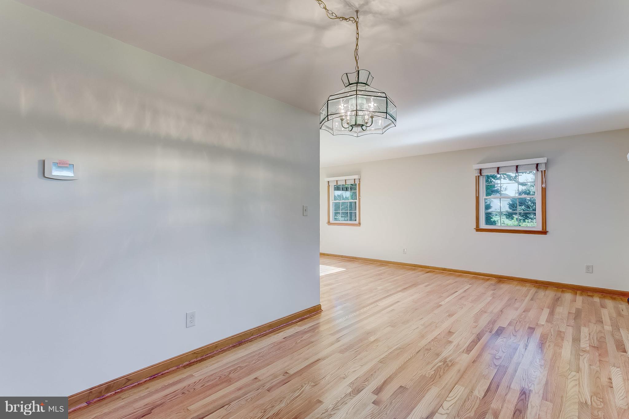 3200 Troyer Road White Hall, MD 21161 - Photo 17 of 36 a view of empty room with wooden floor and window