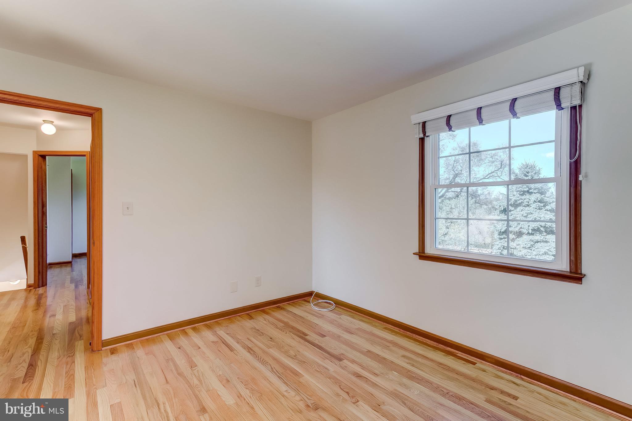 3200 Troyer Road White Hall, MD 21161 - Photo 26 of 36 a view of an empty room with wooden floor and a window