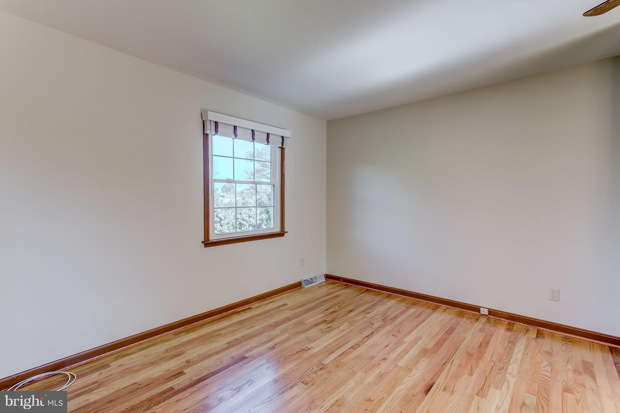 3200 Troyer Road White Hall, MD 21161 - Photo 27 of 36 a view of an empty room with wooden floor and a window