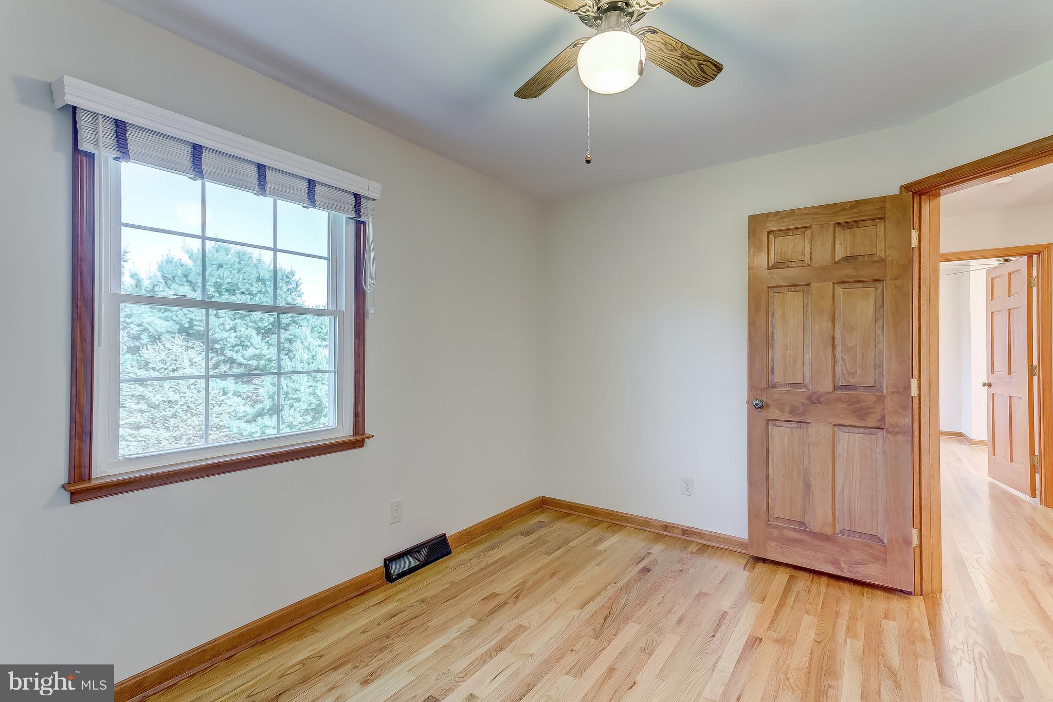3200 Troyer Road White Hall, MD 21161 - Photo 30 of 36 a view of empty room with wooden floor and fan
