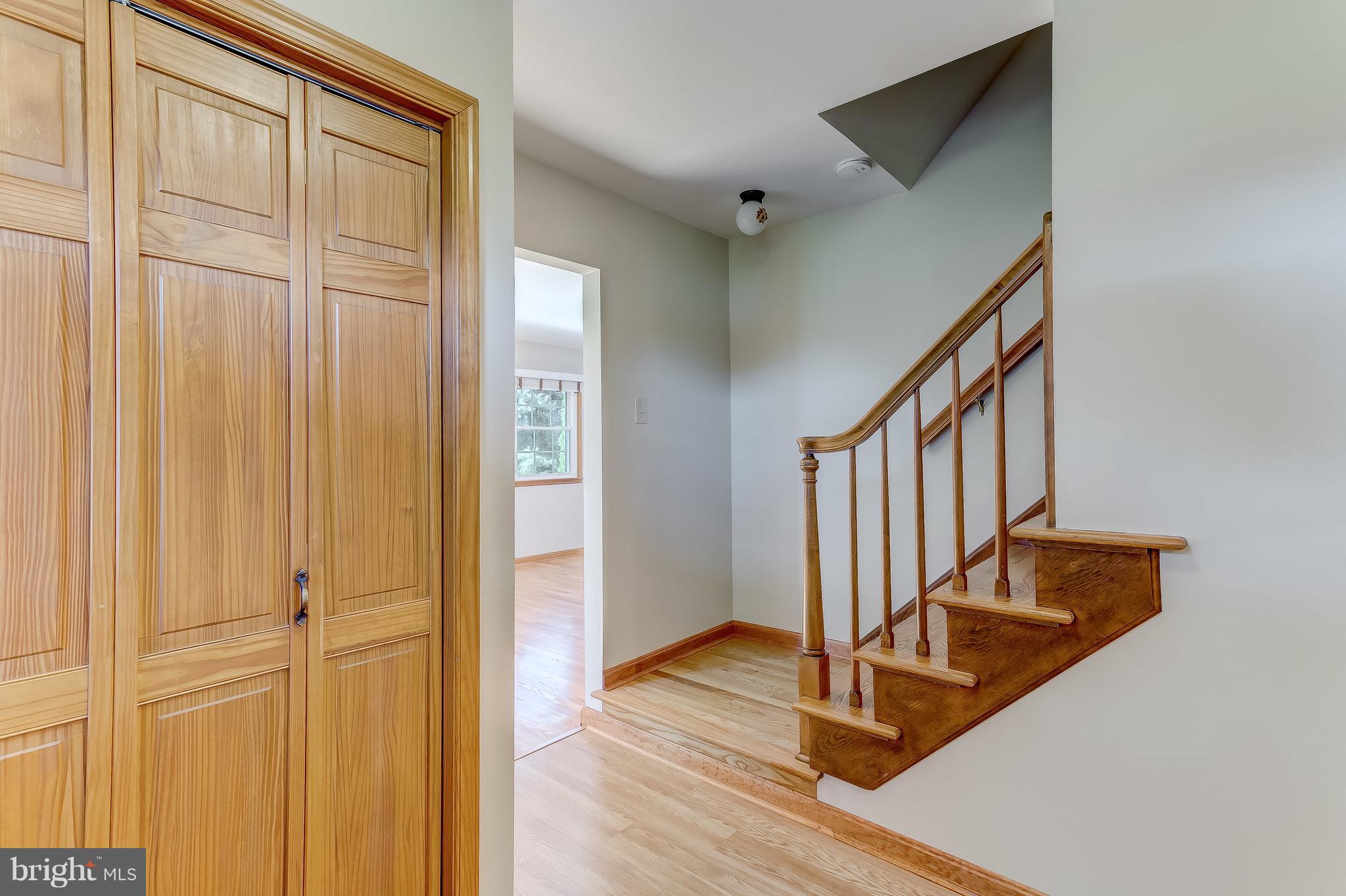3200 Troyer Road White Hall, MD 21161 - Photo 4 of 36 a view of a hallway with wooden floor and staircase