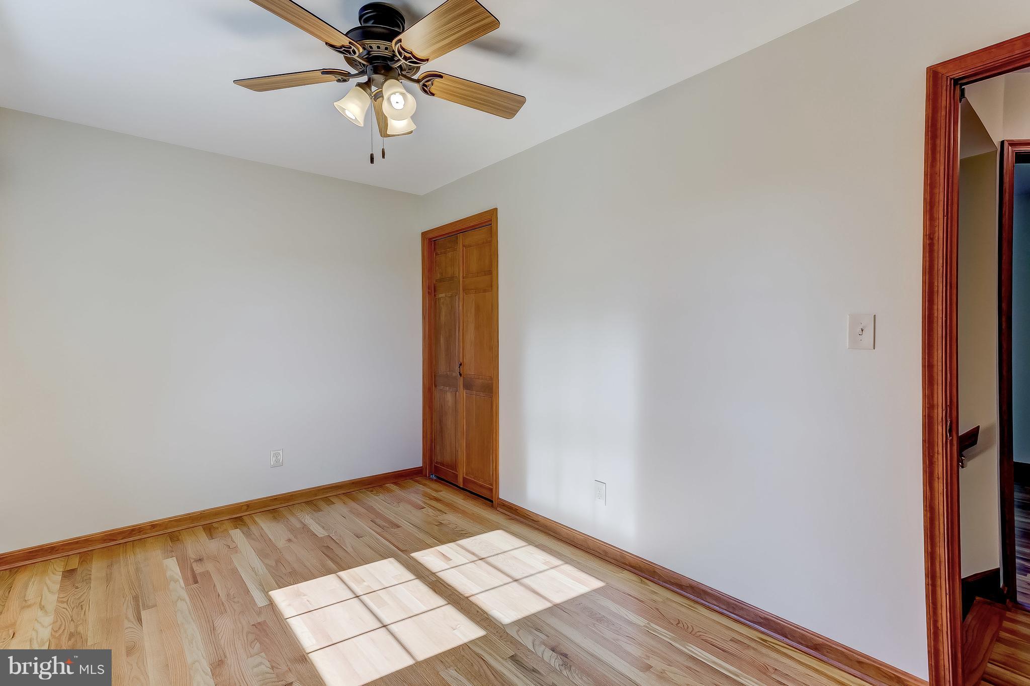 3200 Troyer Road White Hall, MD 21161 - Photo 32 of 36 a view of an empty room and window with a chandelier fan