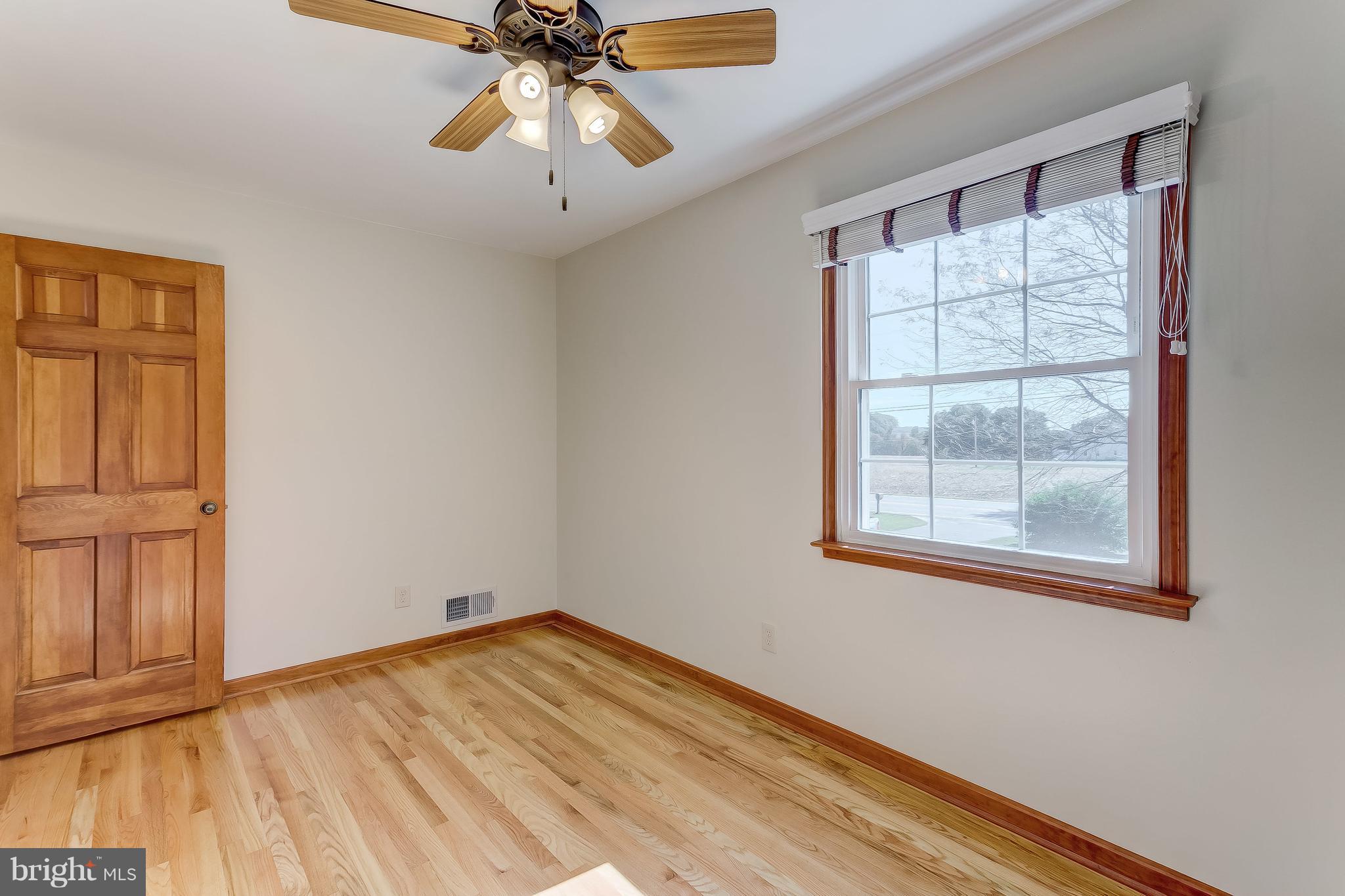 3200 Troyer Road White Hall, MD 21161 - Photo 33 of 36 a view of empty room with wooden floor and fan