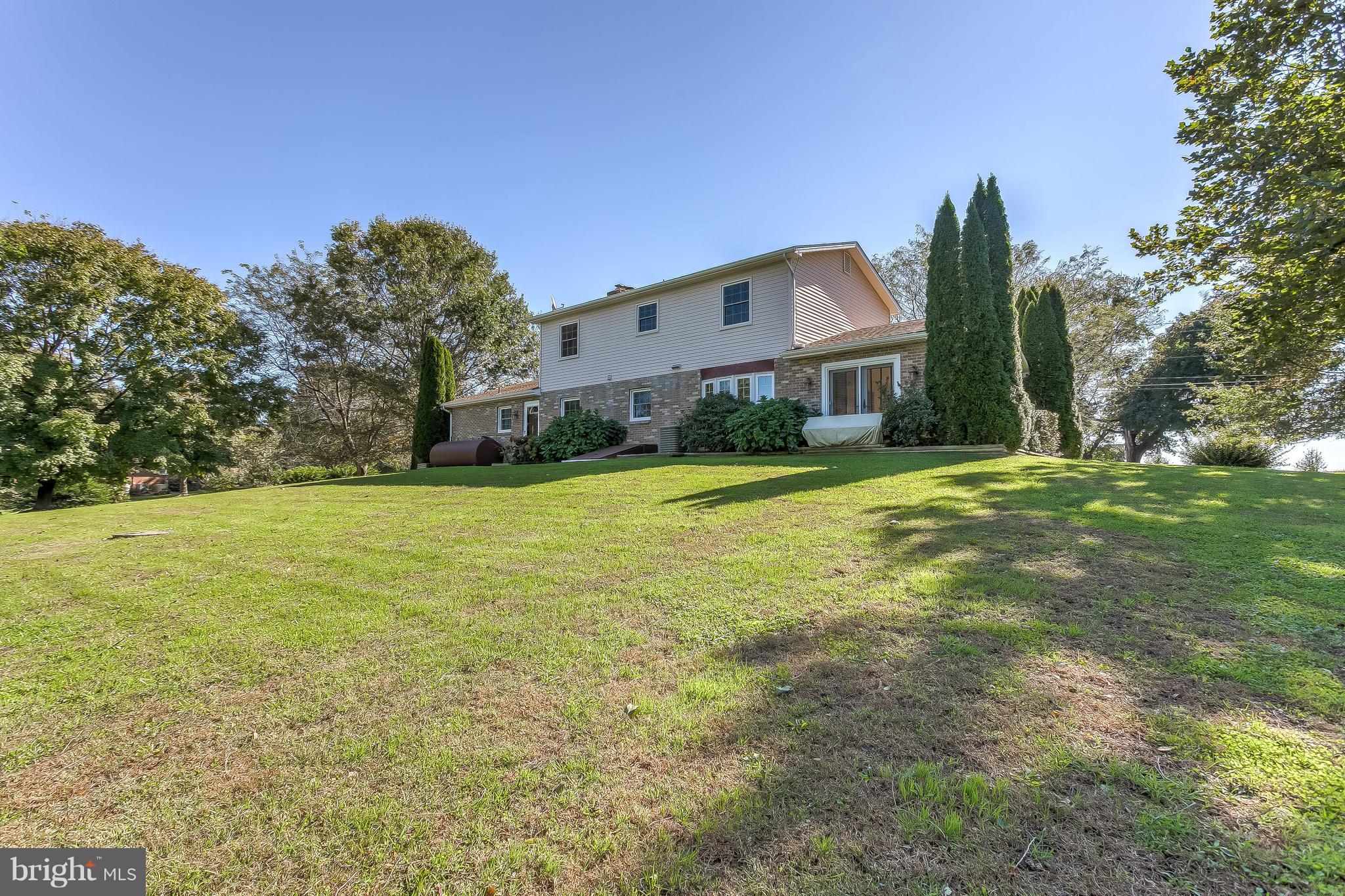 3200 Troyer Road White Hall, MD 21161 - Photo 35 of 36 a front view of house with yard and trees in the background