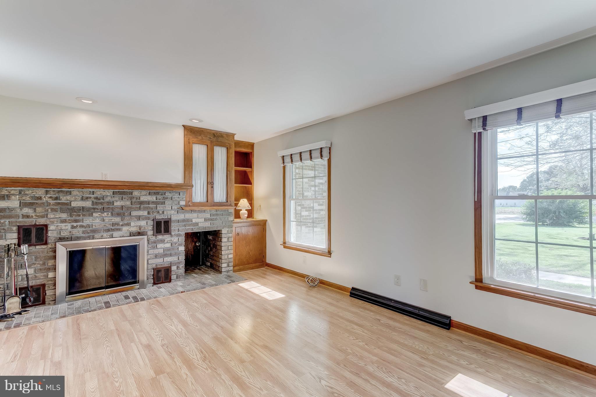 3200 Troyer Road White Hall, MD 21161 - Photo 5 of 36 wooden floor fireplace and natural light in room