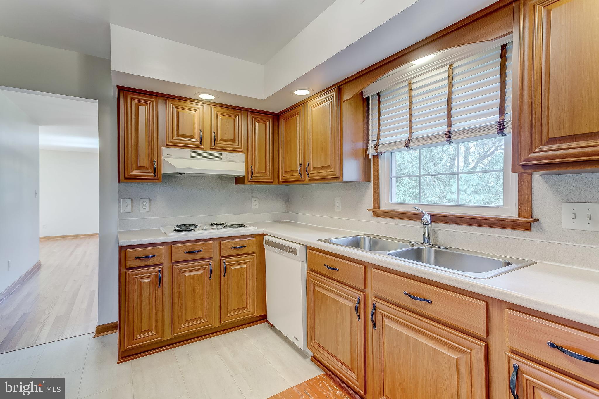 3200 Troyer Road White Hall, MD 21161 - Photo 8 of 36 a kitchen with stainless steel appliances granite countertop a sink stove and cabinets