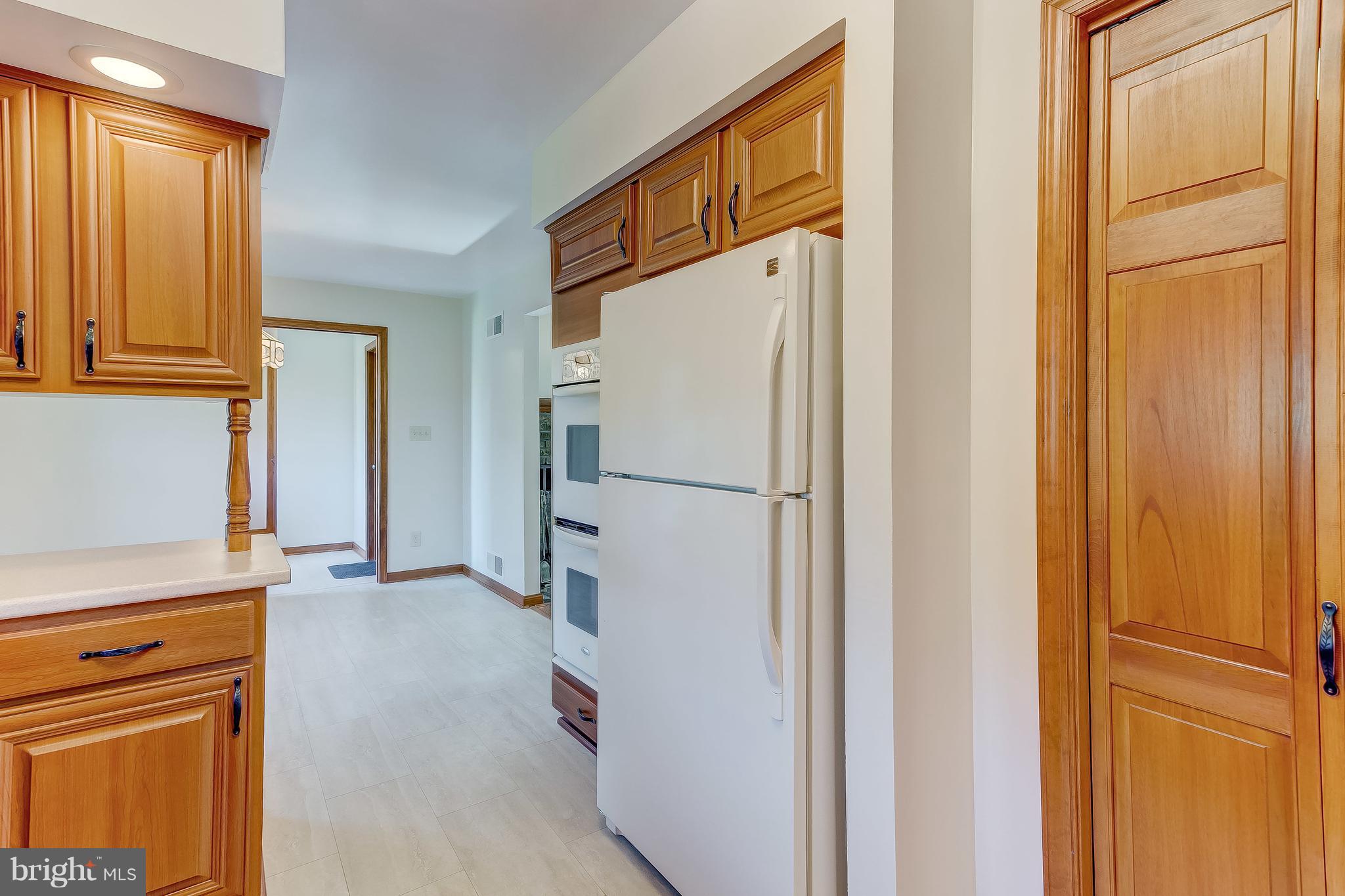 3200 Troyer Road White Hall, MD 21161 - Photo 10 of 36 a view of a kitchen with a refrigerator and cabinets