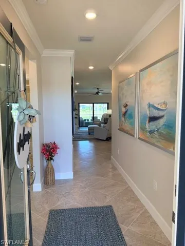 a lobby with furniture and floor to ceiling window