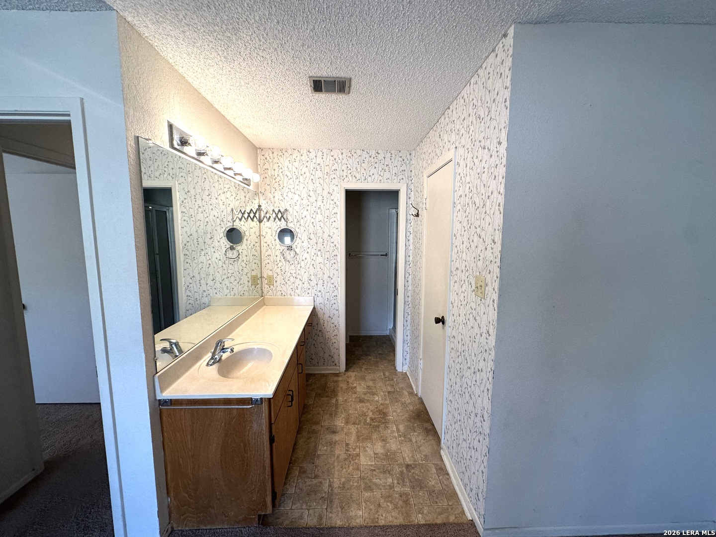 62 Oak Villa Road, Unit F2 Canyon Lake, TX 78133 - Photo 11 of 19 a bathroom with a tub and a sink
