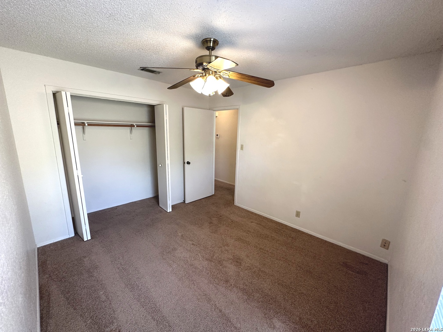 62 Oak Villa Road, Unit F2 Canyon Lake, TX 78133 - Photo 13 of 19 a view of an empty room with a window