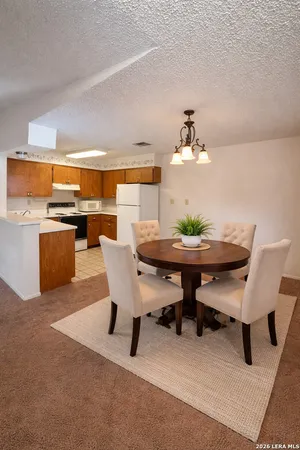 a view of a dining room with furniture