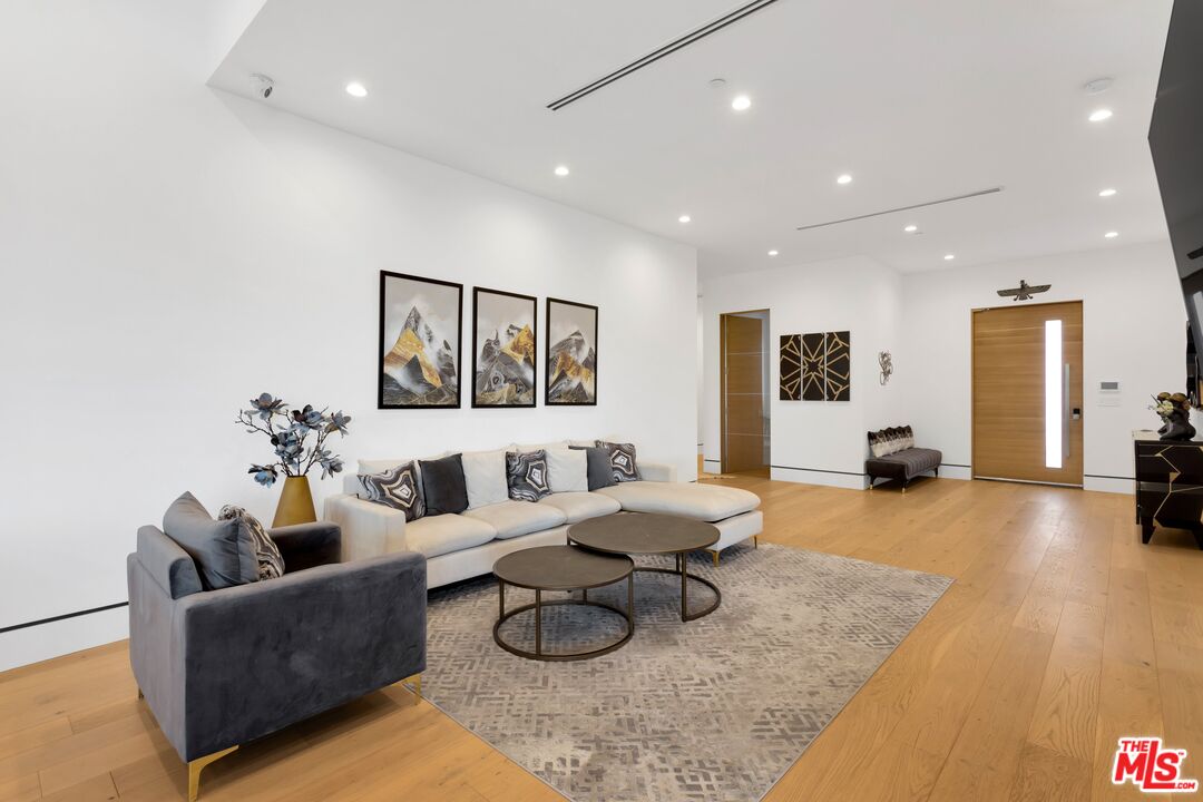 16366 Sloan Drive Los Angeles, CA 90049 - Photo 19 of 54 a living room with furniture and wooden floor